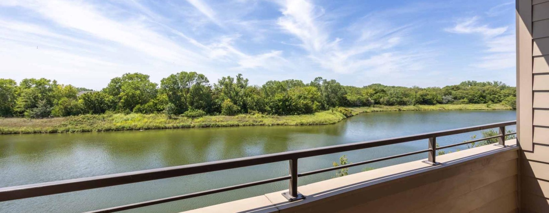 a body of water with trees in the background