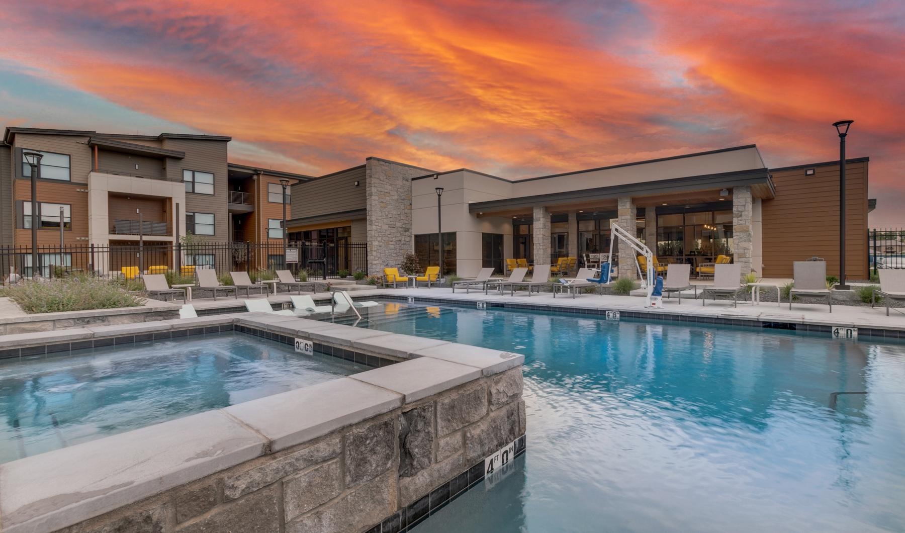 a swimming pool in front of a house